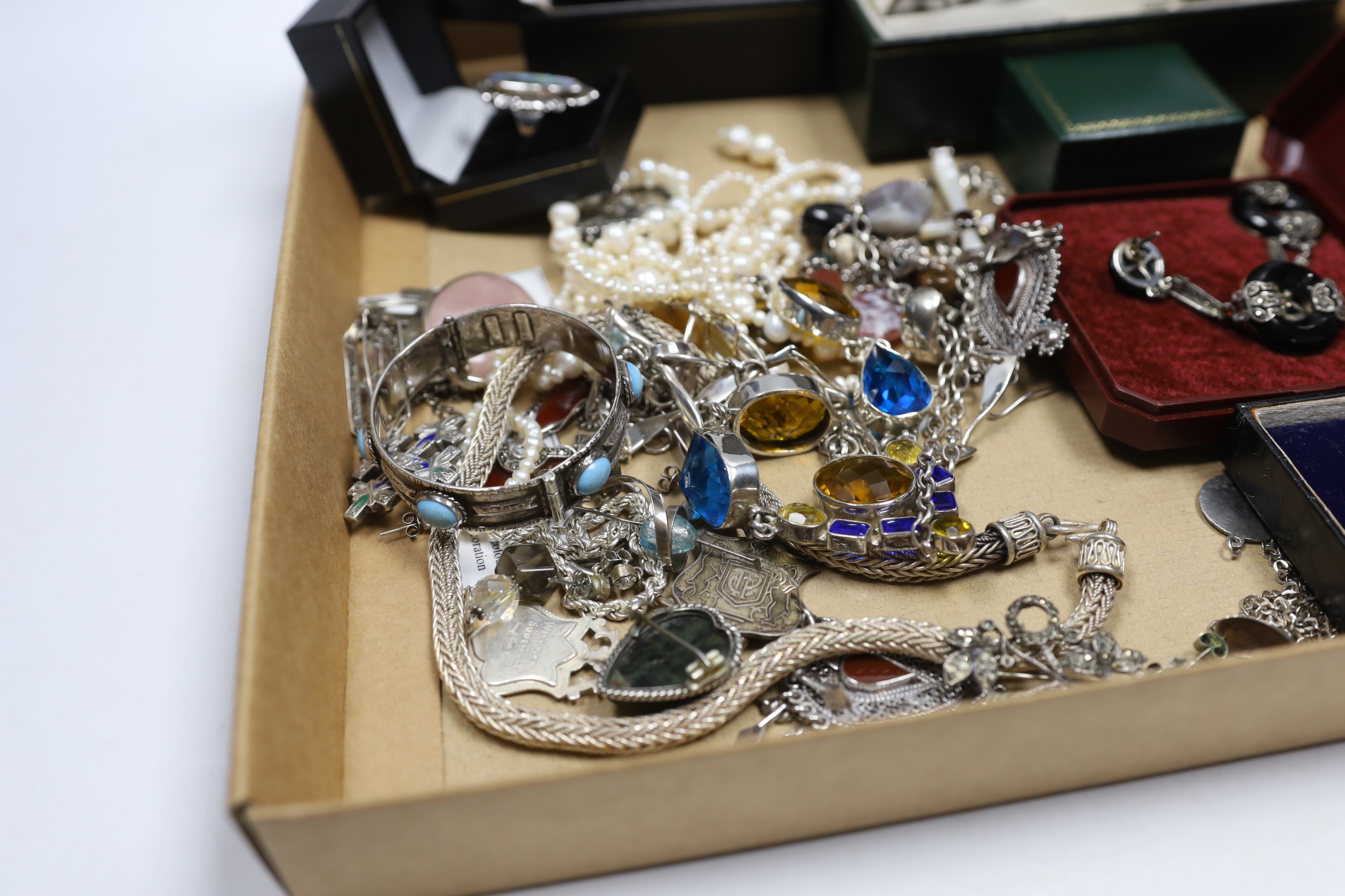 A quantity of assorted silver, 925, white metal and other jewellery including torque necklace, cross pendant necklace, marcasite and onyx set drop earrings, enamelled cross brooch, bangle, medals, dress rings, freshwater